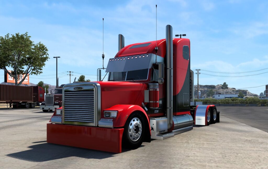 a red semi truck parked in a parking lot