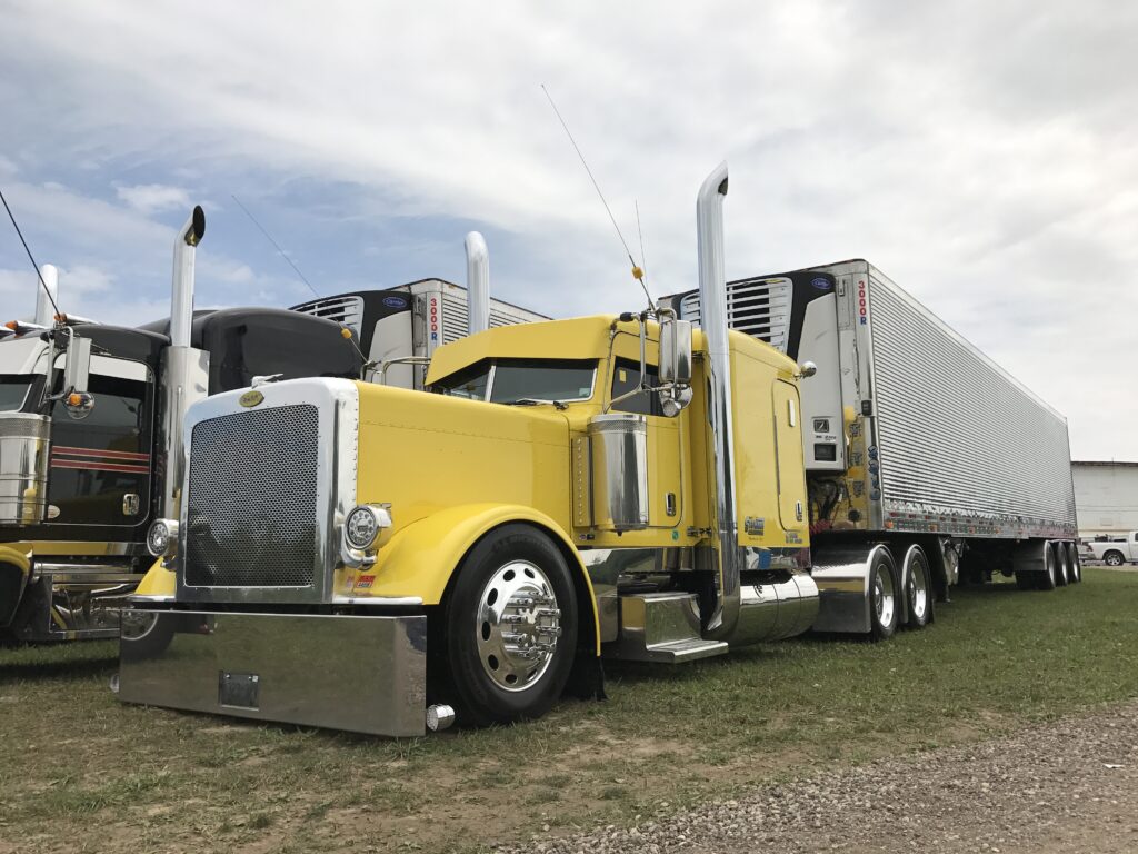 yellow and black truck with side view