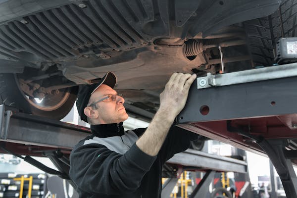 a person working on a truck-contact us page